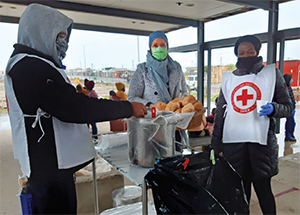 William Ntebe, Natalie Munro and Fikiswa Gxamesi delivering soup to patients at the Hermanus CDC in Swartdam Road.